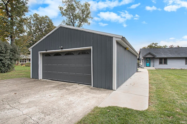 garage featuring a lawn