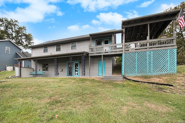 back of house with a yard and a wooden deck