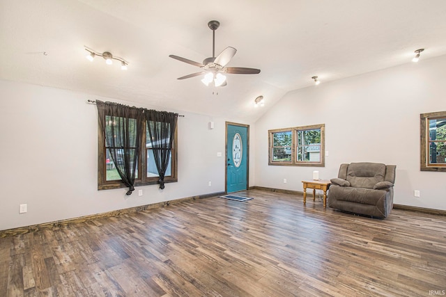 unfurnished room featuring ceiling fan, wood-type flooring, and vaulted ceiling