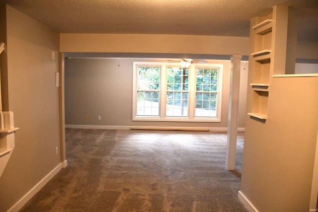 interior space featuring a textured ceiling and ceiling fan