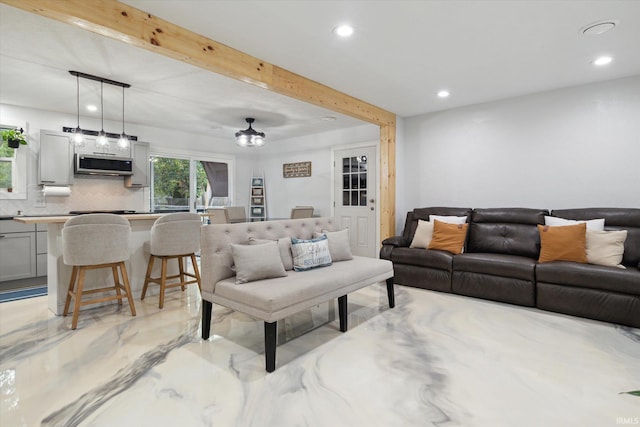 living room featuring beam ceiling