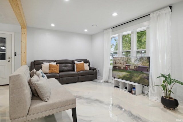 living room featuring beam ceiling