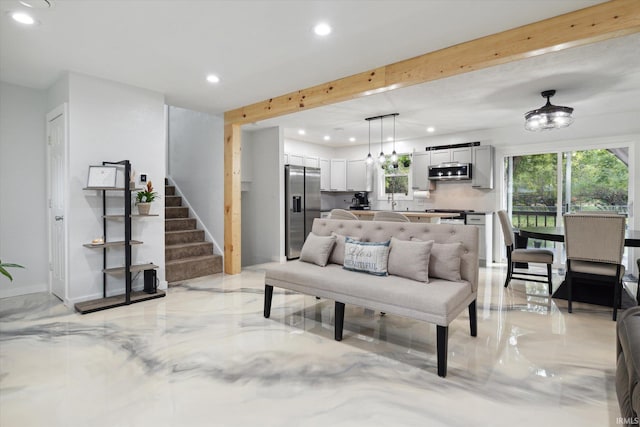 living room featuring beam ceiling