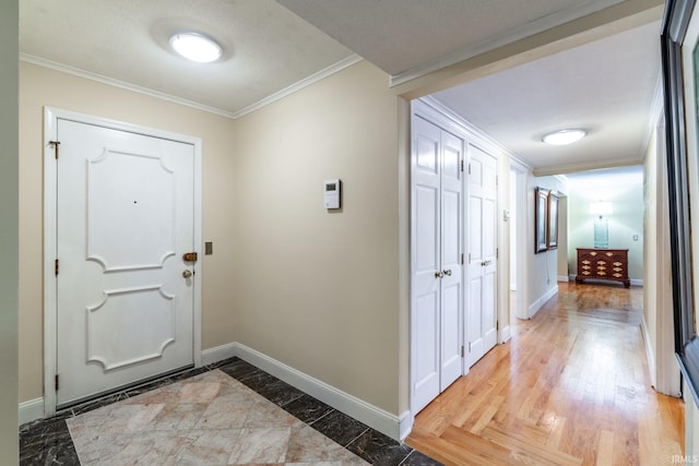 entrance foyer with crown molding and wood-type flooring