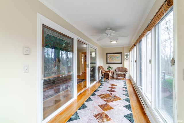 sunroom with ceiling fan