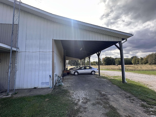 878 N Base Rd, Rockport, IN 47635 - view of parking / parking lot featuring a carport and dirt driveway