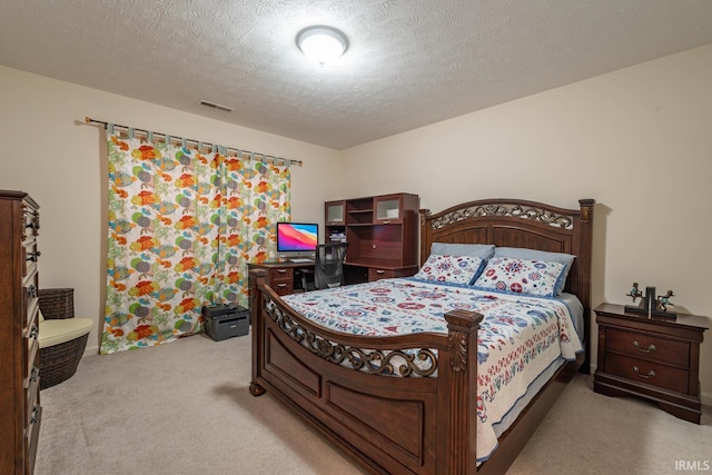 carpeted bedroom with a textured ceiling