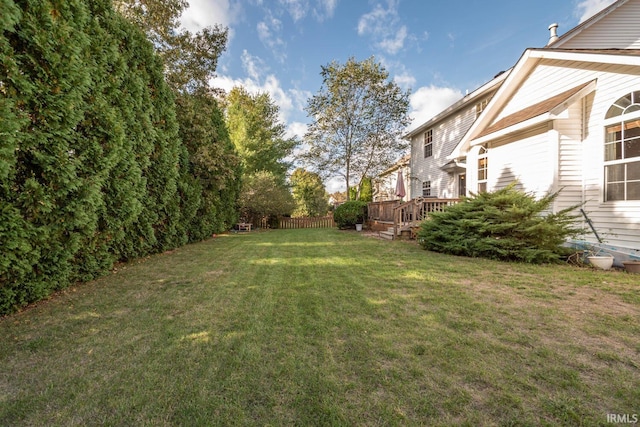 view of yard with a wooden deck