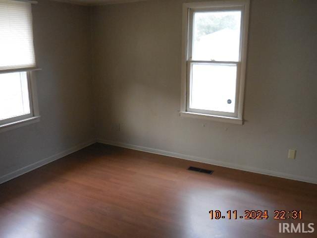 empty room featuring hardwood / wood-style flooring