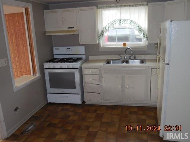 kitchen featuring extractor fan, white cabinetry, sink, and white appliances