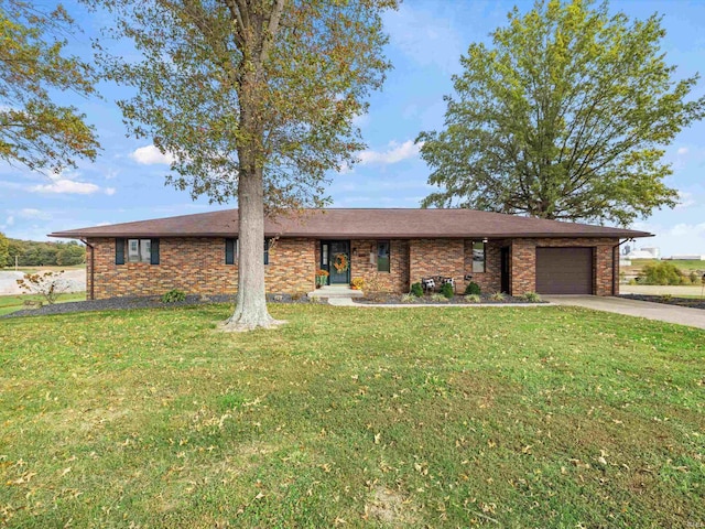 ranch-style home featuring a front yard and a garage