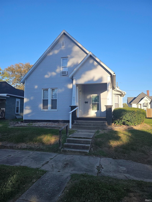 bungalow-style house with a front yard and a porch