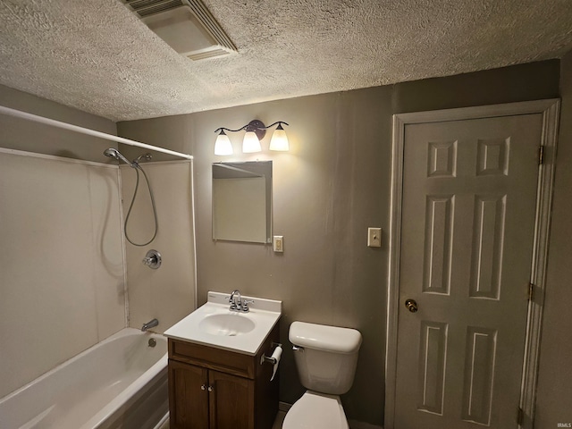 full bathroom with shower / bathtub combination, vanity, toilet, and a textured ceiling