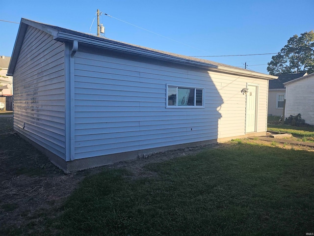 view of property exterior with a lawn