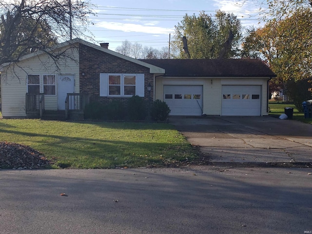 ranch-style home featuring a front lawn and a garage