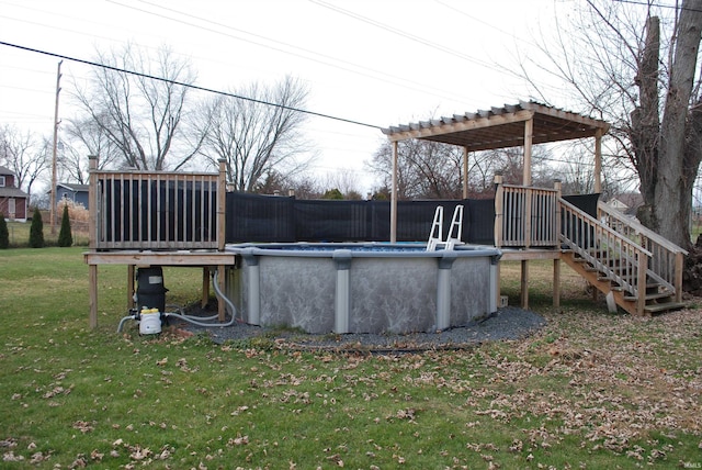 view of pool with a lawn