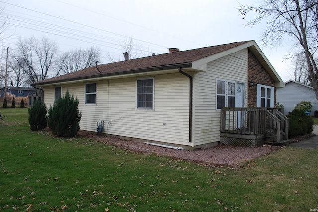 view of property exterior with a lawn