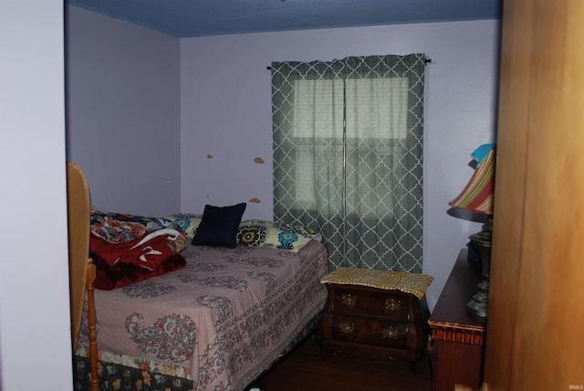 bedroom with hardwood / wood-style flooring