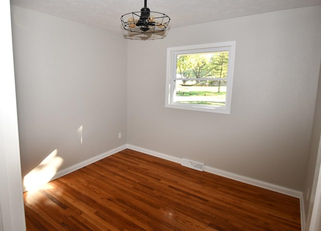 empty room featuring dark hardwood / wood-style floors