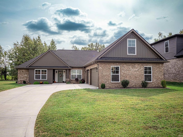 view of front of property with a front yard and a garage