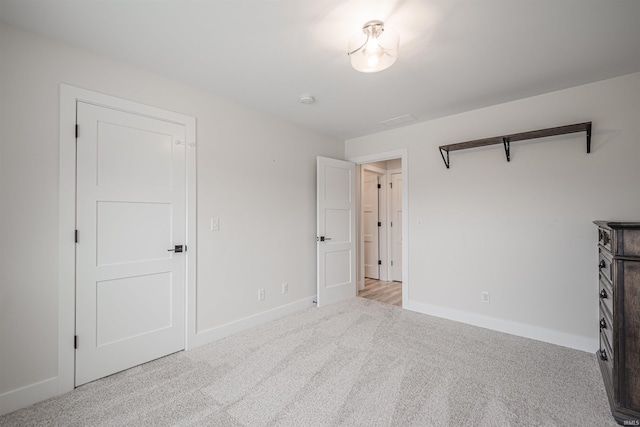 unfurnished bedroom with light carpet