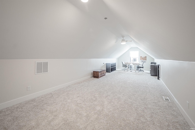 bonus room featuring ceiling fan, carpet, and lofted ceiling