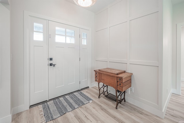 entryway with light hardwood / wood-style flooring