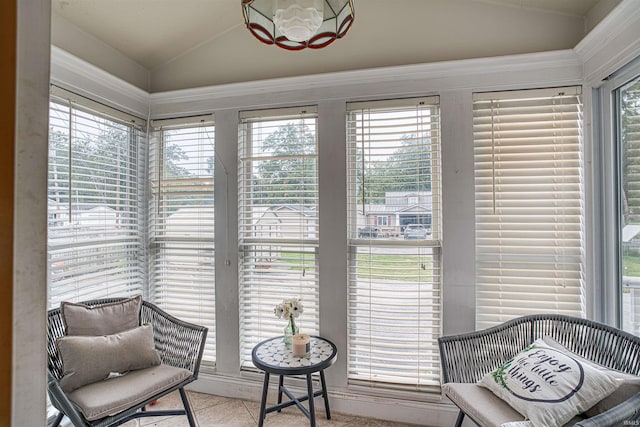 sunroom / solarium featuring lofted ceiling