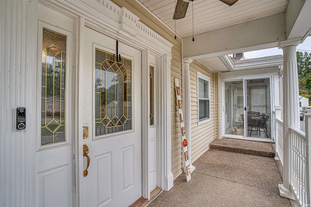 property entrance featuring covered porch and ceiling fan