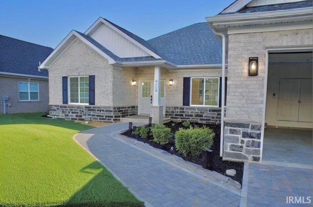 doorway to property featuring a yard