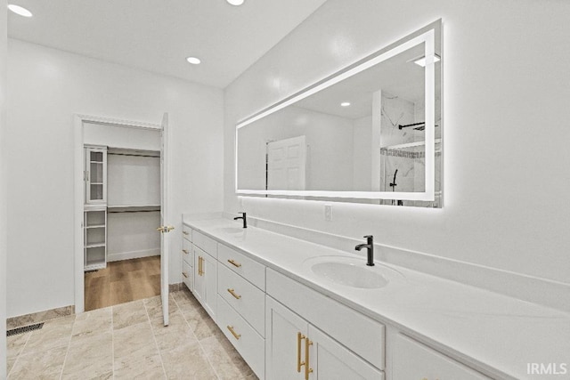 bathroom featuring vanity and walk in shower