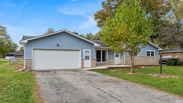 ranch-style house with a garage and a front lawn