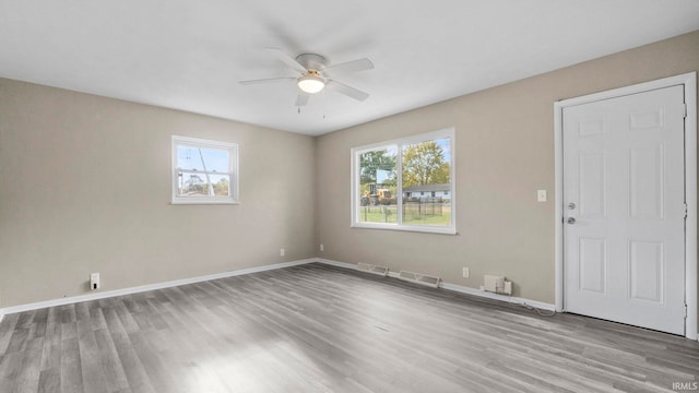 unfurnished room with light hardwood / wood-style floors and ceiling fan