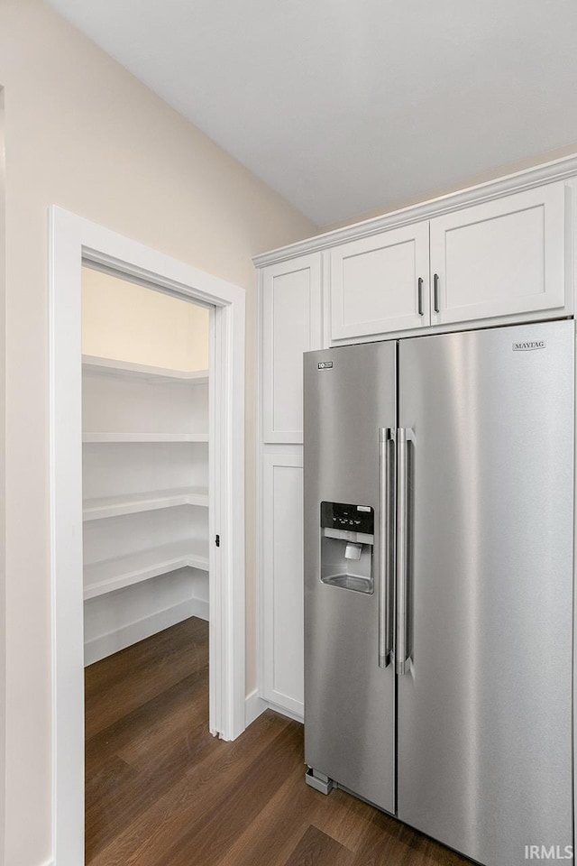 kitchen featuring white cabinetry, stainless steel refrigerator with ice dispenser, and dark hardwood / wood-style floors