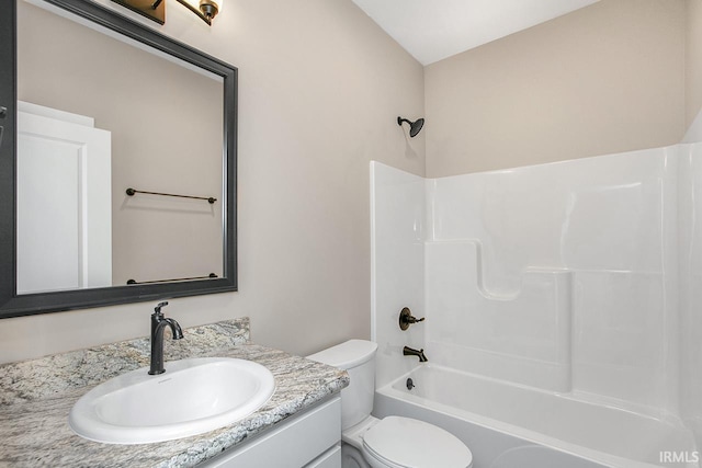 full bathroom featuring toilet, vanity, and shower / bathtub combination