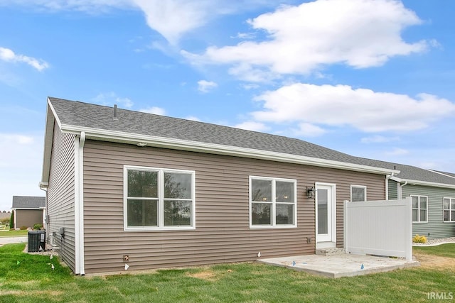 rear view of house with a lawn