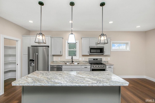 1916 Newbury Cir, Goshen, IN 46526 - kitchen with stainless steel appliances, dark wood finished floors, a center island, light stone countertops, and recessed lighting