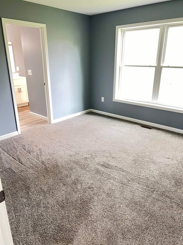 view of carpeted spare room