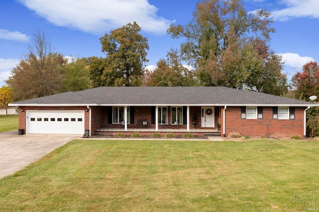 ranch-style home featuring a front yard, a porch, and a garage