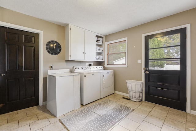 2324 W 56th Hwy, Scottsburg, IN 47170 - clothes washing area with cabinet space, independent washer and dryer, baseboards, and light tile patterned floors