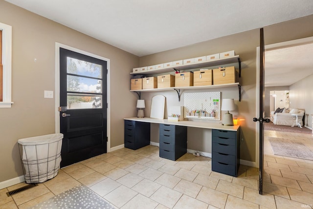 interior space with light tile patterned floors