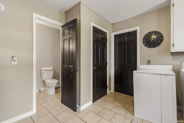 2324 W 56th Hwy, Scottsburg, IN 47170 - laundry area with baseboards, laundry area, and light tile patterned flooring
