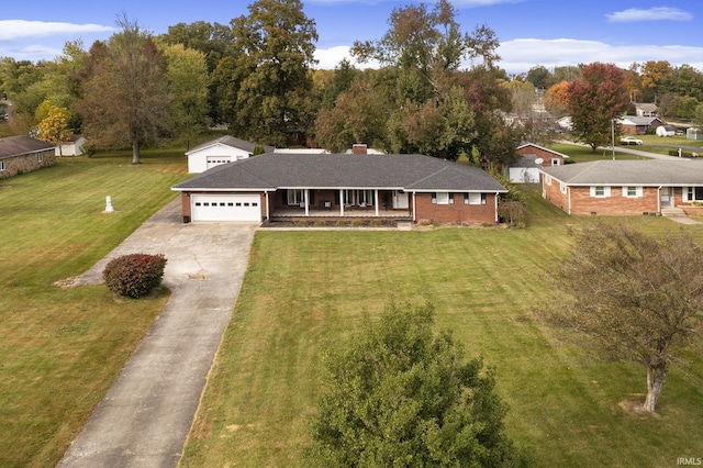 2324 W 56th Hwy, Scottsburg, IN 47170 - view of front of house with a garage, covered porch, concrete driveway, and a front lawn