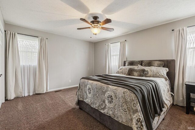 2324 W 56th Hwy, Scottsburg, IN 47170 - carpeted bedroom featuring visible vents, a ceiling fan, and baseboards