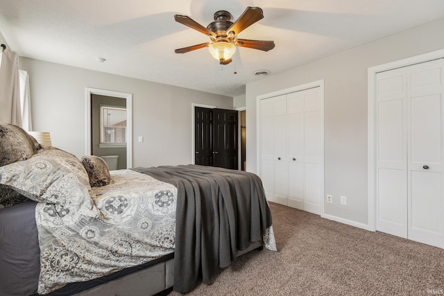 2324 W 56th Hwy, Scottsburg, IN 47170 - carpeted bedroom featuring baseboards, ceiling fan, two closets, and visible vents