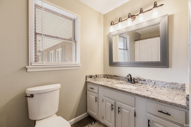 2324 W 56th Hwy, Scottsburg, IN 47170 - full bathroom featuring vanity, baseboards, and toilet