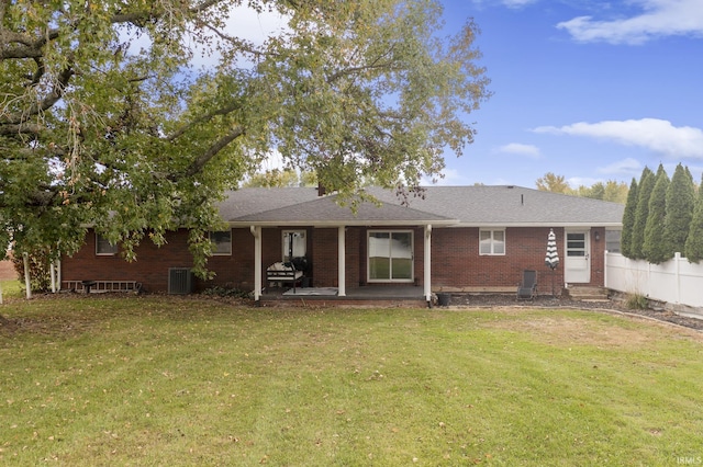 2324 W 56th Hwy, Scottsburg, IN 47170 - rear view of house featuring brick siding, entry steps, cooling unit, a patio area, and a yard