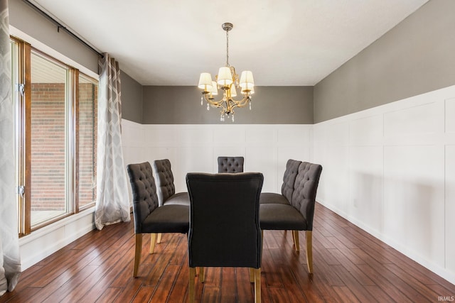 2324 W 56th Hwy, Scottsburg, IN 47170 - dining area with an inviting chandelier, dark wood-style flooring, and a healthy amount of sunlight