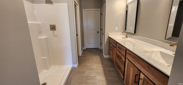 bathroom featuring vanity and a shower