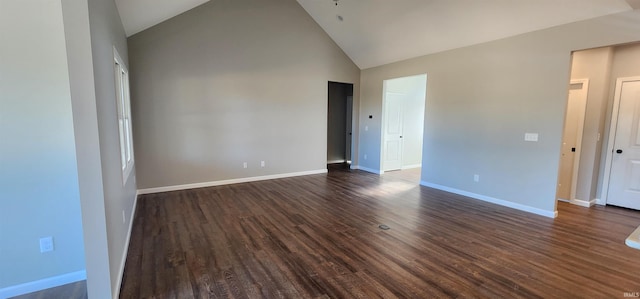 empty room featuring dark hardwood / wood-style floors and high vaulted ceiling